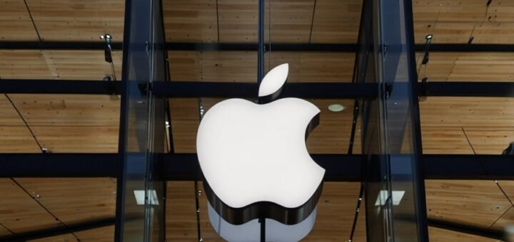 A sleek iPhone on a dark background with the EU flag faintly overlaid, symbolizing Apple’s legal battle against EU regulations.